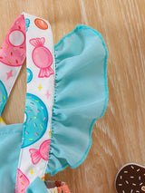 Robe sans manches pour bébé fille avec imprimé de beignets et bonbons doux, avec décoration de nœud papillon et ourlet volant pour robe-body d'été