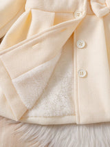 Souflis Souflis Manteau de robe d'anniversaire élégante d'hiver blanc pour bébé fille. Veste à ligne A en mélange de laine avec col bouffant, nœud 3D et manches longues. Tenue de princesse chaude et de couleur unie