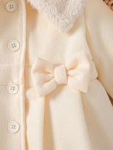 Souflis Souflis Manteau de robe d'anniversaire élégante d'hiver blanc pour bébé fille. Veste à ligne A en mélange de laine avec col bouffant, nœud 3D et manches longues. Tenue de princesse chaude et de couleur unie